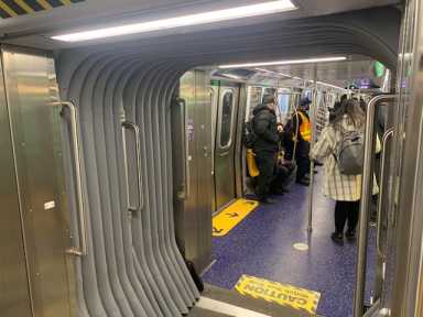 inside an open gangway train which is a walk-through train