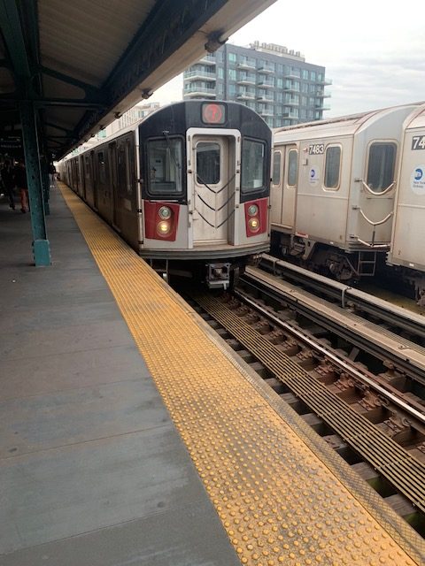 7 train arriving at a station