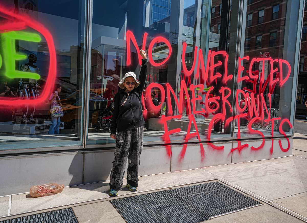 Caught red-handed: Environmental activists vandalize Tesla dealership in Manhattan to protest Elon Musk on Earth Day 3