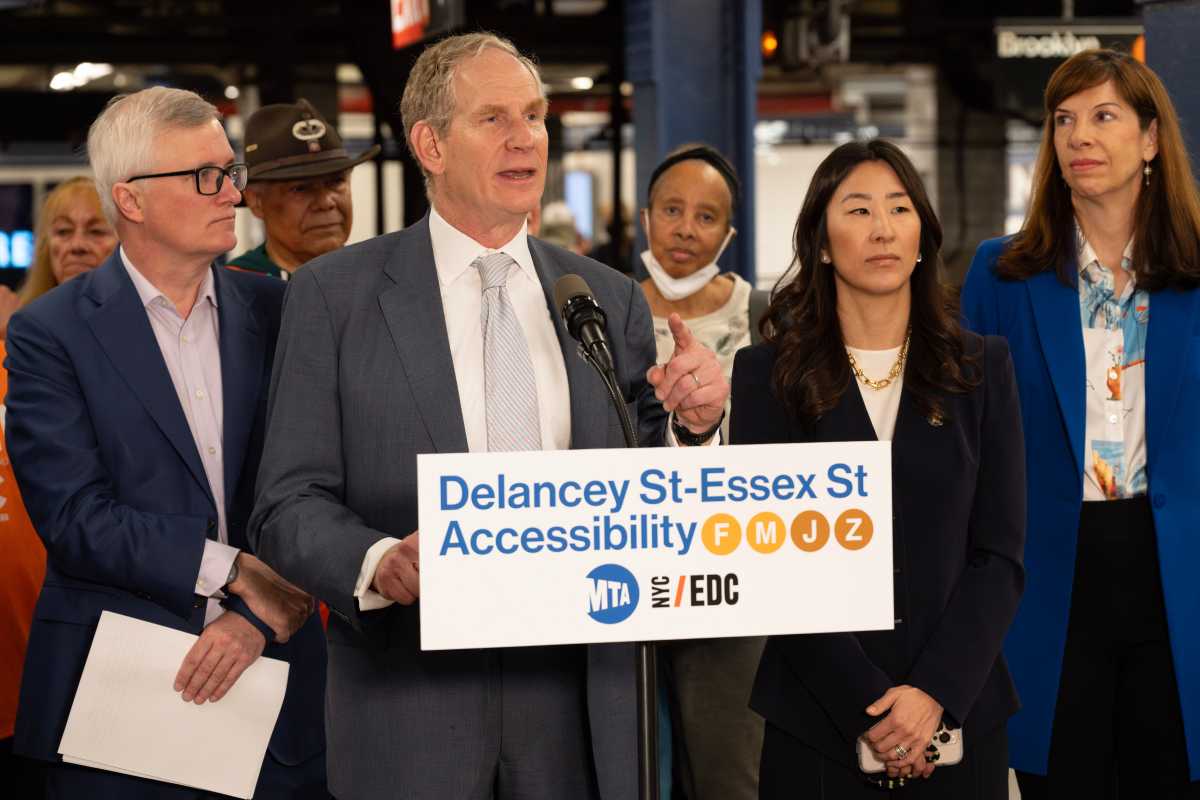 Janno Lieber (center) and officials announce accessibility upgrades that are coming to the Delancey St–Essex St Station complex.
