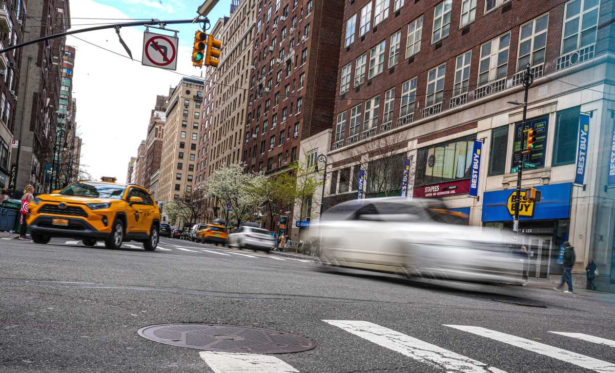 cars driving on the road in NYC