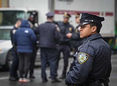 NYPD officer looking on patrol.