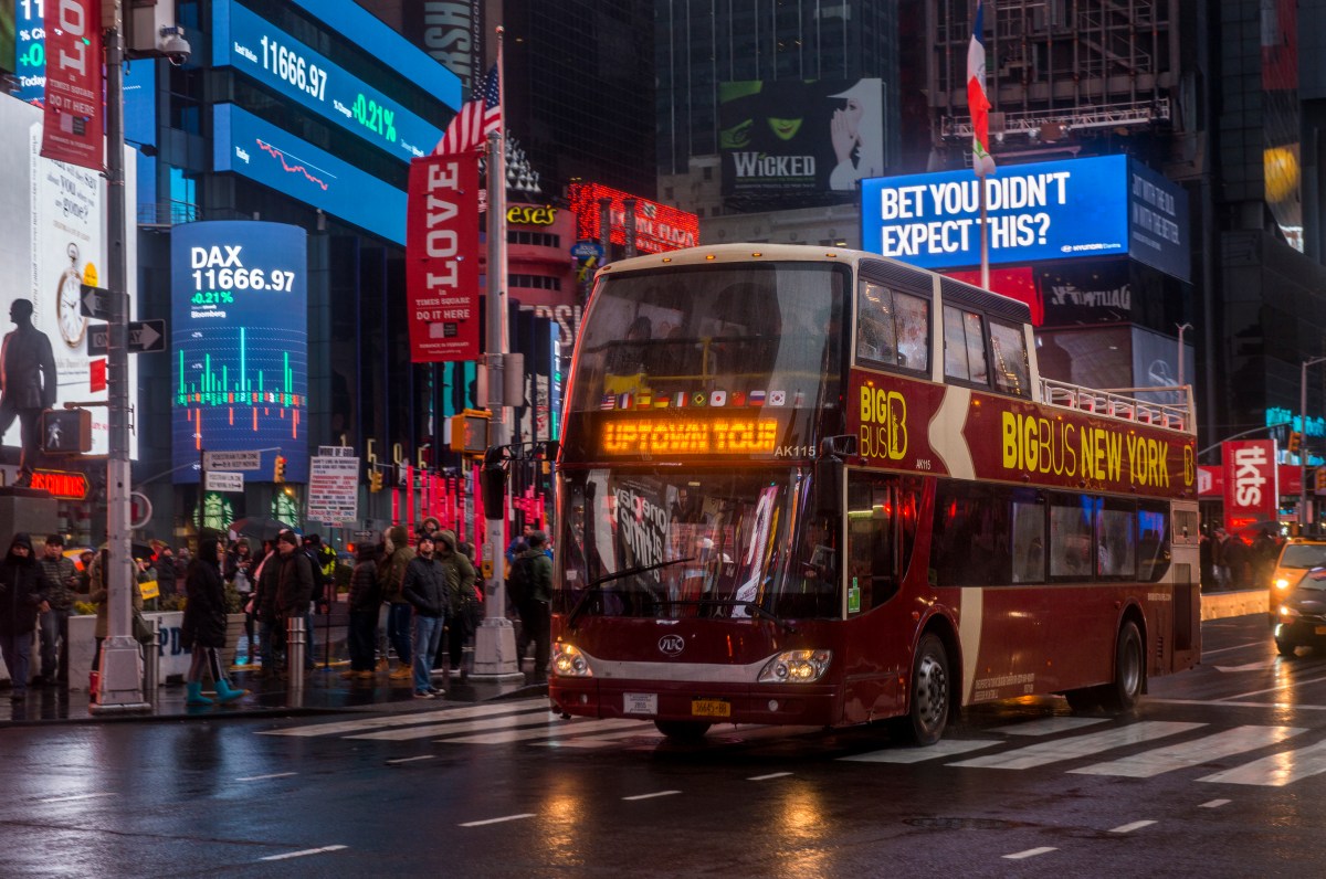 FIRST ON amNY: Two major Times Square bus tour companies caught in alleged collusion scheme that cost tourists big bucks 2 NYC tour bus in Times Square at night