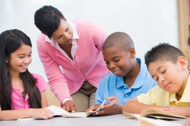 Teacher with school students amid New York literacy crisis
