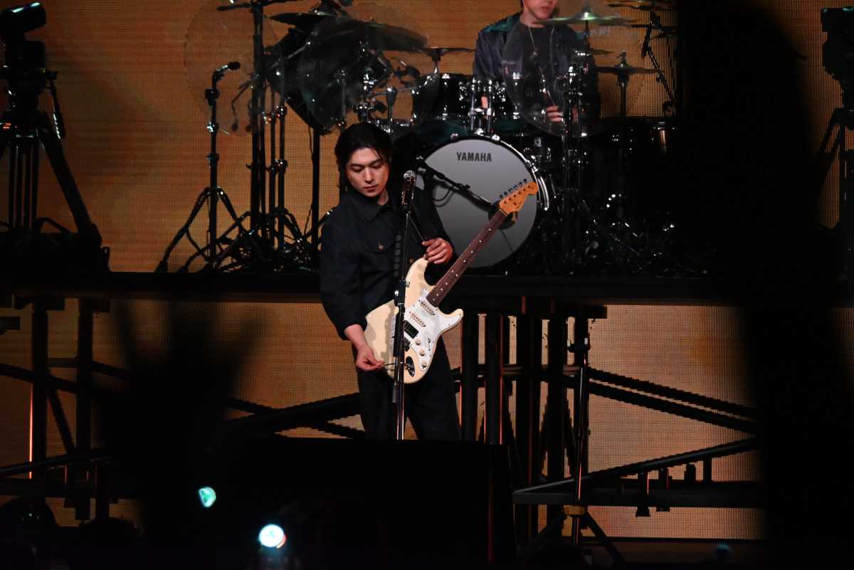 Day6's Sungjin on guitar.