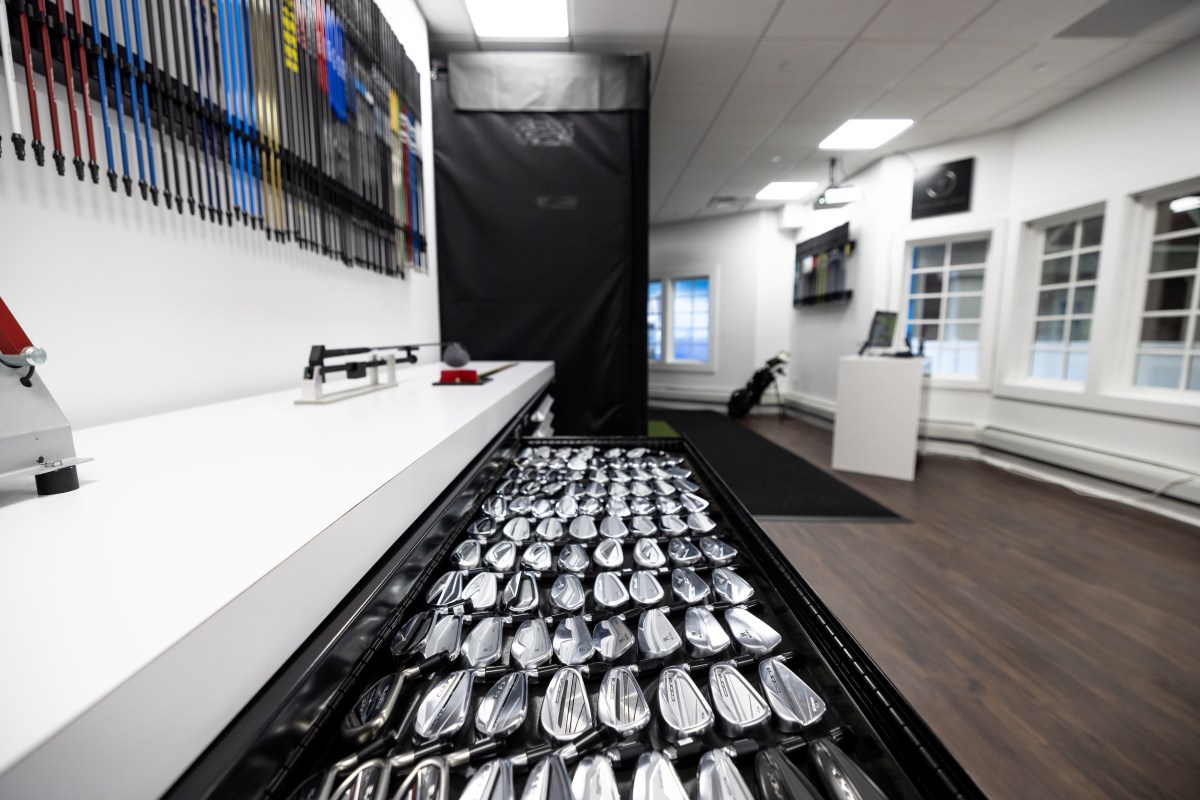 True Spec Golf brings custom fitting experience to Chelsea Piers 3 a draw of club heads at True Spec Golf.