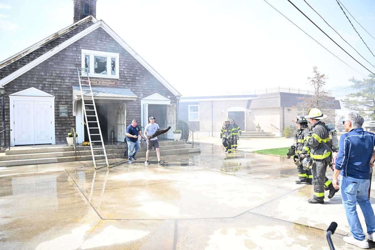 Firefighter outside Queens church during fire