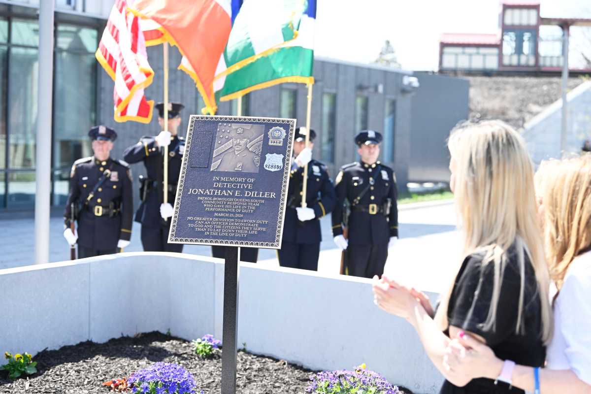 a plaque in Queens to slain NYPD officer Jonathan Diller