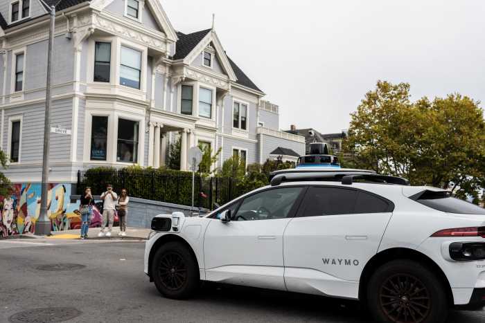A Waymo autonomous vehicle: Uber has partnered with the self-driving car company to offer driverless rides in cities like Austin, Phoenix, and soon Atlanta