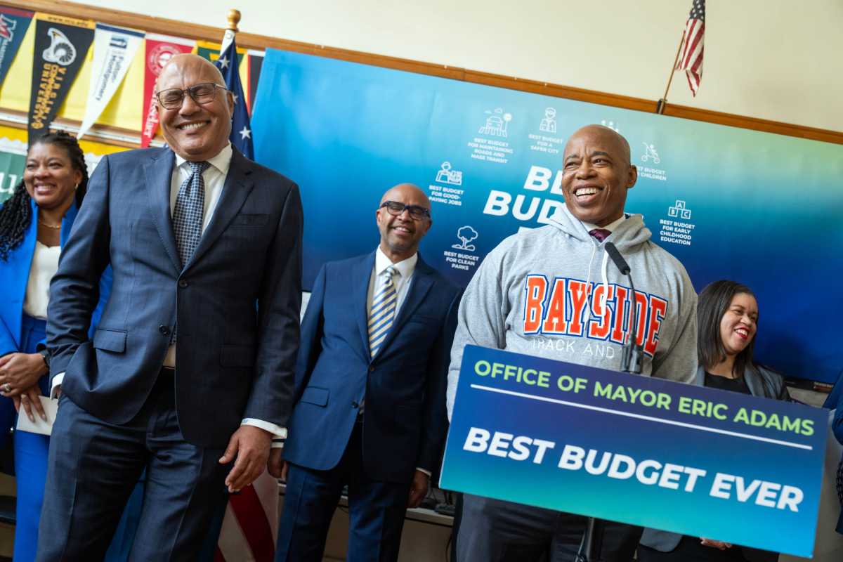 Mayor Adams smiling while speaking about NYC budget