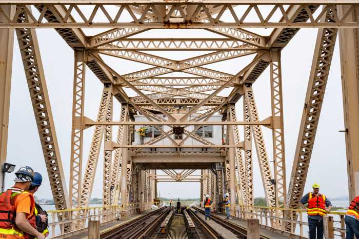 construction workers on a bridge