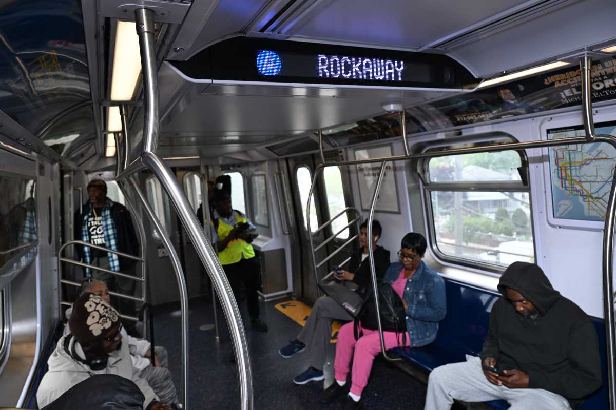 NYC Transit riders on board an A train in the Rockaways