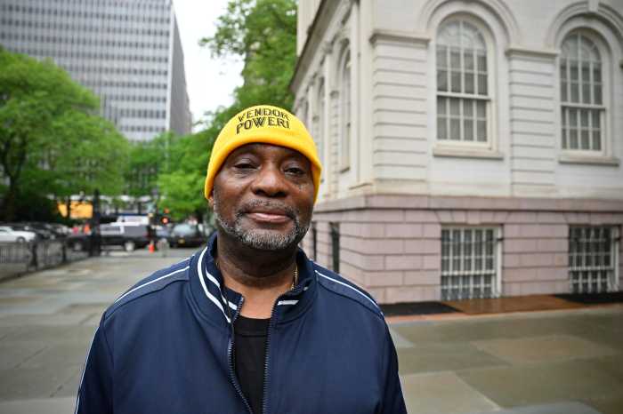 NYC street vendors and supporters rally at City Hall to demand long-delayed license reform: 'I want to do it legally, not illegally' 2 man wearing a yellow hat outside at a street vending rally