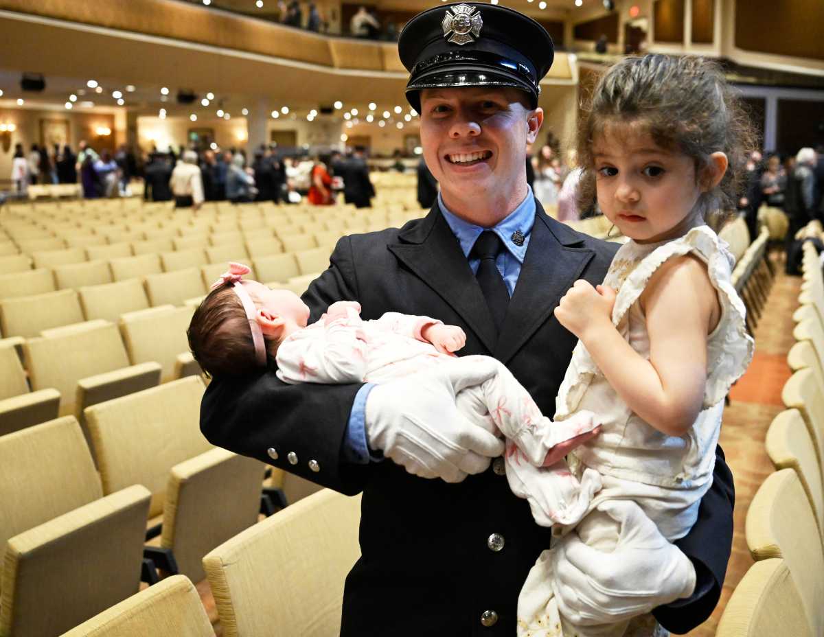 Joseph J. Angelini, III, 26, pictured with his children, graduated from the FDNY fire academy following in the footsteps of his grandfather, decorated and senior Firefighter Joseph Angelini Sr of Rescue Company 1 and his father Firefighter Joseph Angelini Jr.