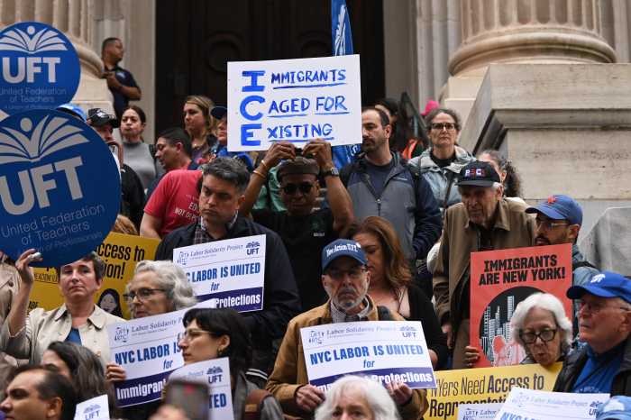 People at City Hall protesting ICE arrest of high school student