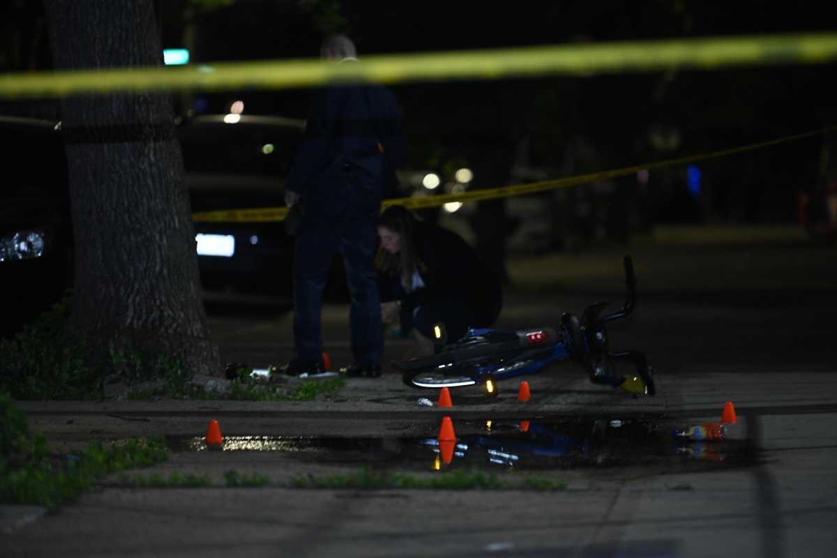 Crime scene tape and puddle of blood at scene of Brooklyn double shooting