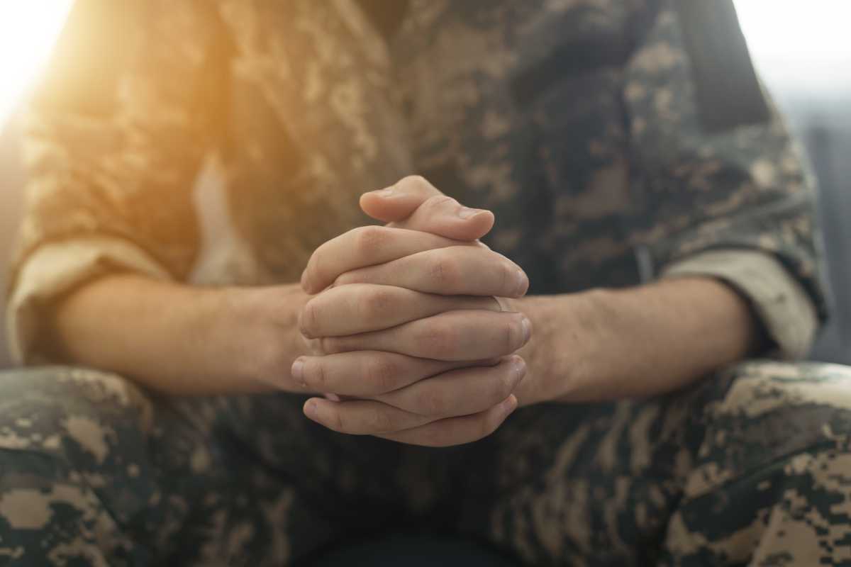 Portrait of middle aged sad, desperate military man during therapy session. Disabled soldier suffering from depression psychological trauma. PTSD concept