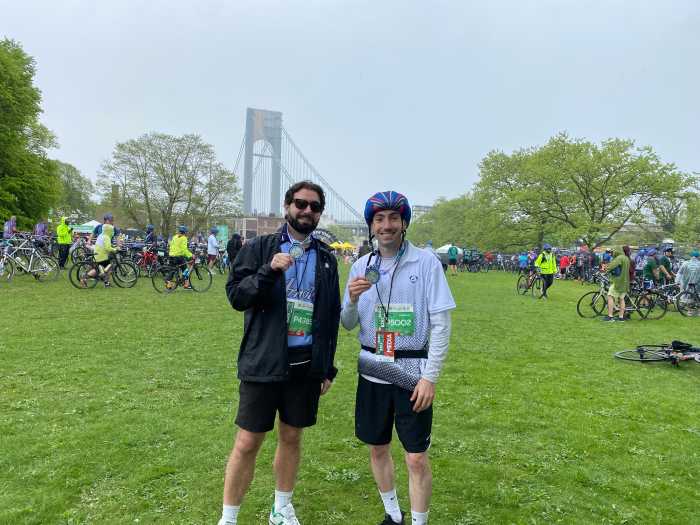 What rain? Thousands turn out for TD Five Boro Bike Tour through NYC on Sunday despite dreary skies 6 two men holding medals after a race