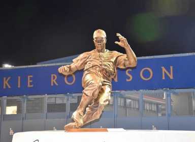 Rendering of the upcoming Jackie Robinson statue outside the Jackie Robinson Museum in Hudson Square. The eight-foot bronze sculpture is one of several projects funded through a $4.5 million state grant