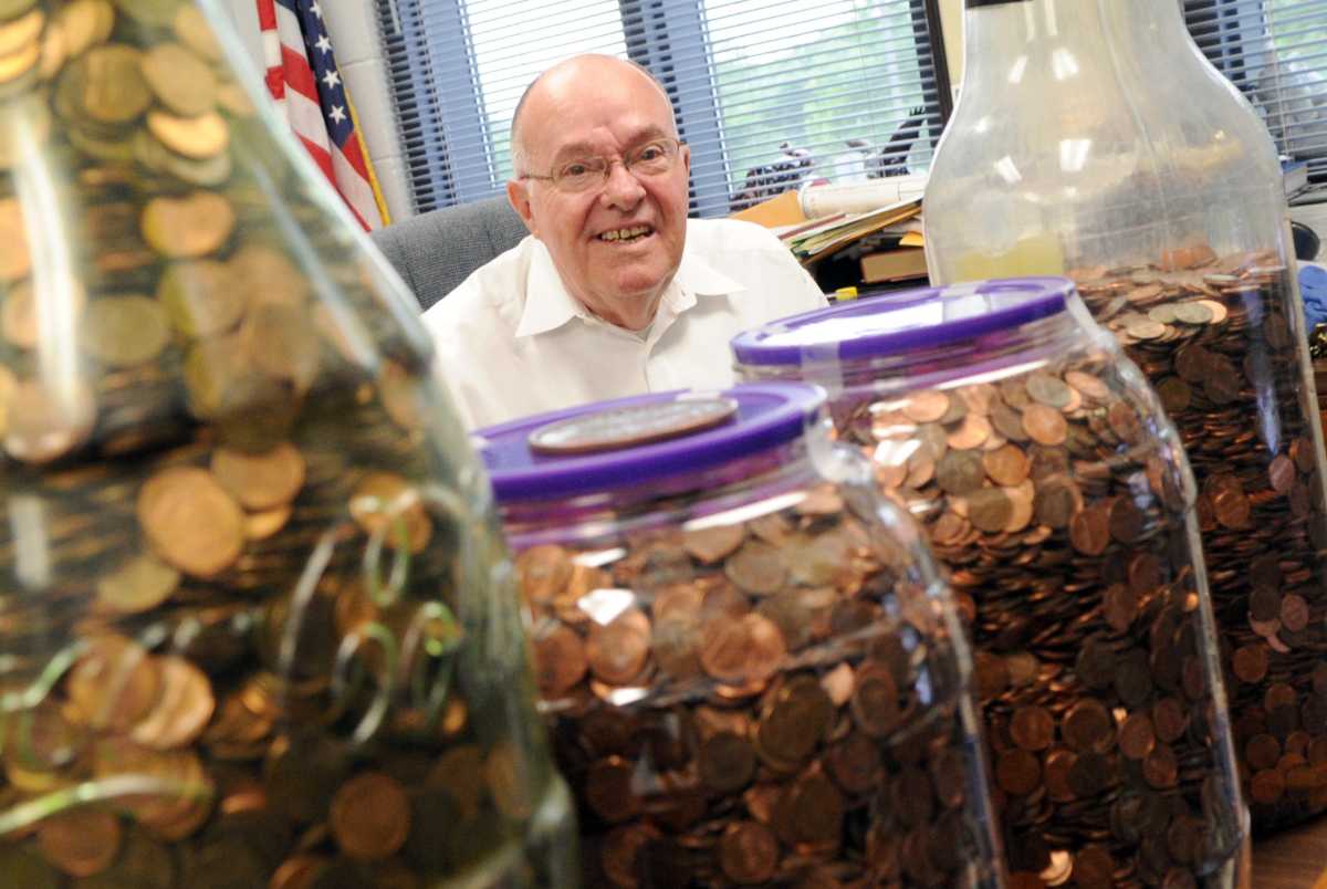 Richard Bean, superintendent of the Richard L. Bean Juvenile Detention Center, poses with pennies he has collected for the Pennies for Undies program at his office Friday, July 17, 2011. Bean has collected 52,000 so far and hopes to reach 100,000 pennies t