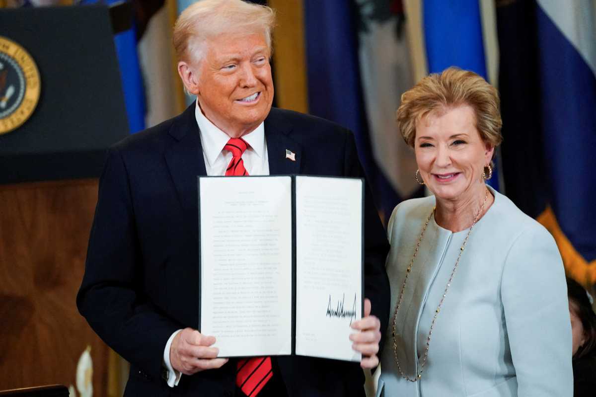 U.S. President Donald Trump signs an executive order to shut down the Department of Education