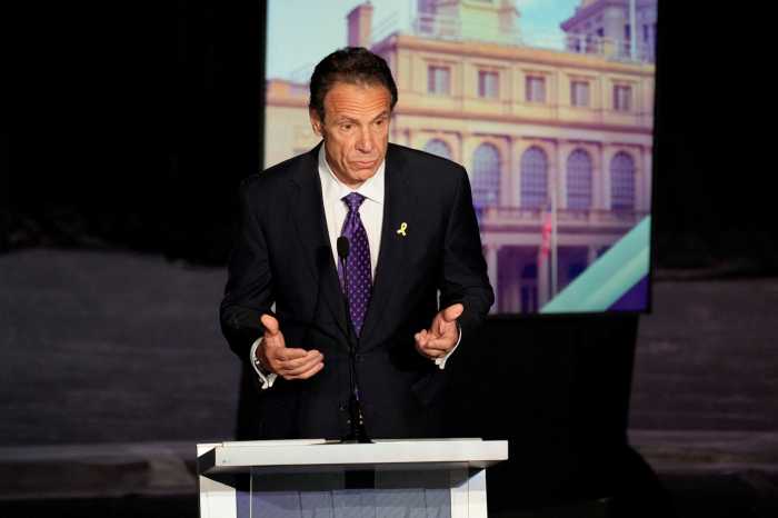 Andrew Cuomo speaking at podium