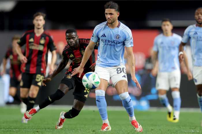 Jun 12, 2025; New York, New York, USA; New York City FC midfielder Justin Haak (80) controls the ball against Atlanta United forward Jamal Thiare (14) during the second half at Yankee Stadium. Mandatory Credit: Brad Penner-Imagn Images