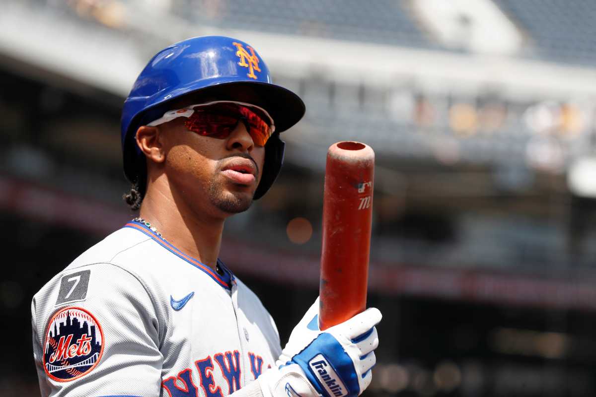Mets season continues to fall apart as they're swept away by lowly Pirates 2 Mets player looking at bat while wearing sunglasses and helmet