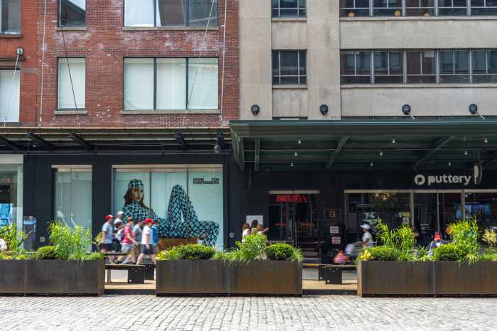 outdoor seating space next to a cobblestone street in the Meatpacking District