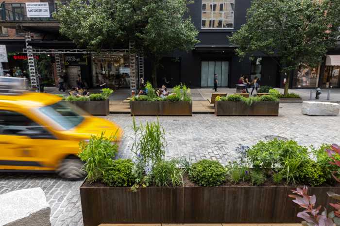 Meatpacking District’s historic makeover continues with a new promenade and less room for cars 3 a taxi cab riding on a cobblestone street next to a promenade
