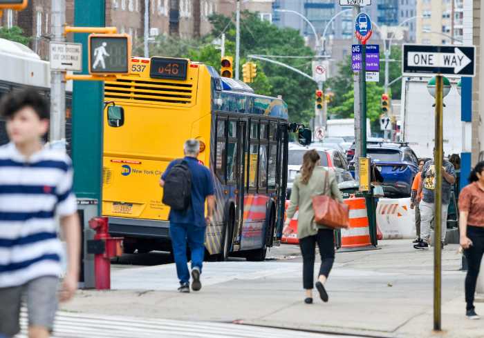 new yorkers run to catch the MTA bus