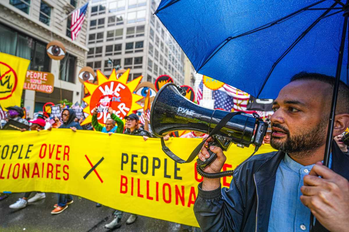 Man uses bullhorn during No Kings Day march