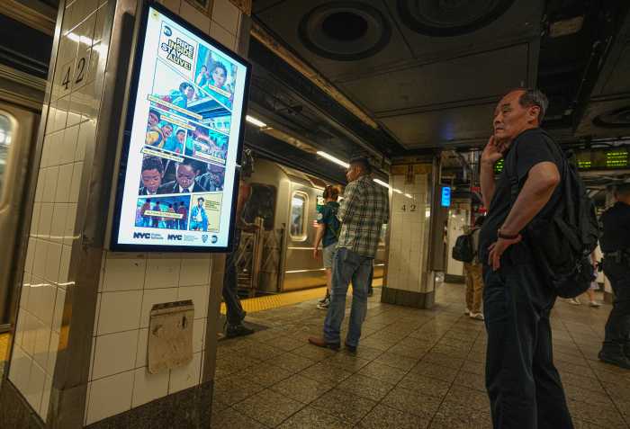 people waiting in a NYC subway station