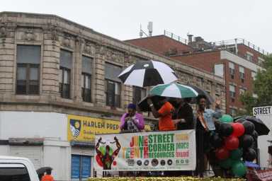 Harlem residents faced the rain to celebrate Juneteenth this past weekend.