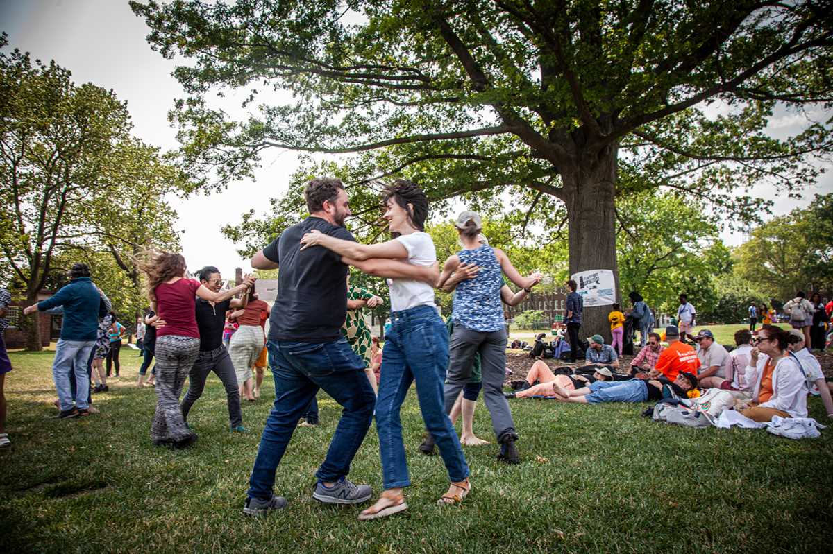 New Yorkers dancing to folk music at the 2024 Porch Stomp festival on Governors Island. 