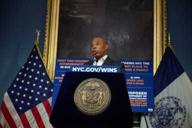 Mayor Eric Adams speaking at City Hall amid ICE raids