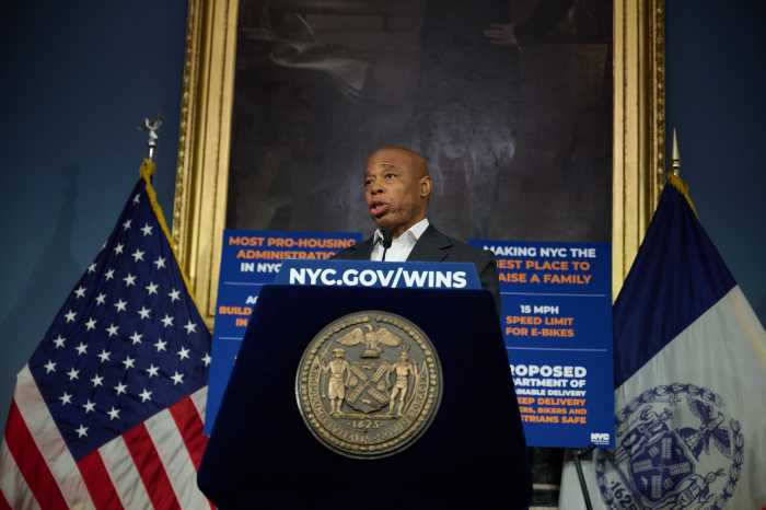 Mayor Eric Adams speaking at City Hall amid ICE raids
