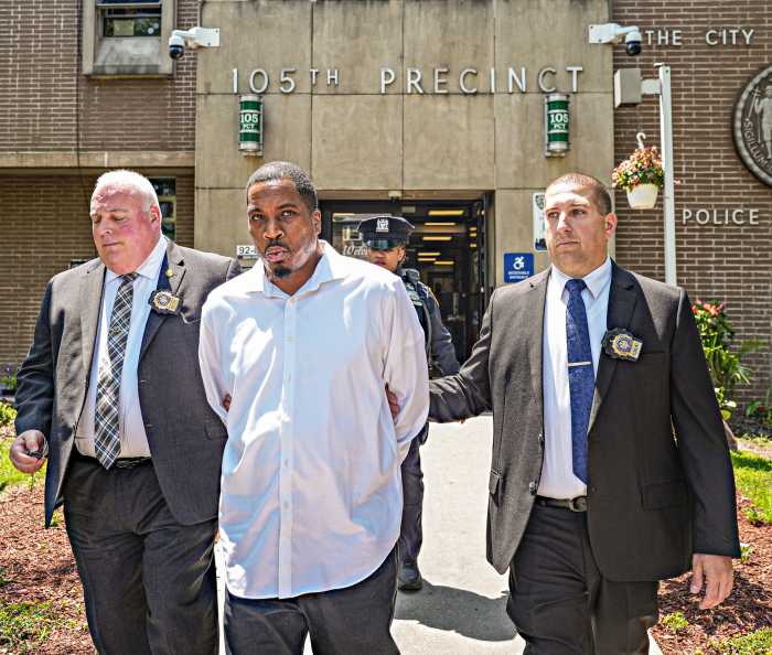 Queens hit-and-run driver under arrest and escorted by detectives