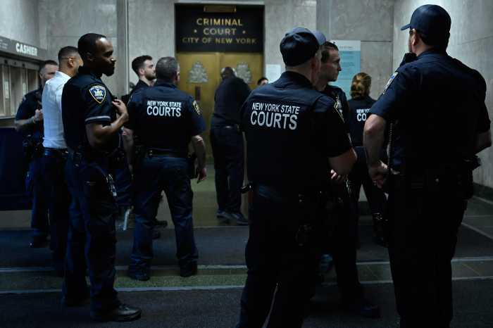 court officers standing at the Manhattan criminal courthouse where a stabbing recently took place