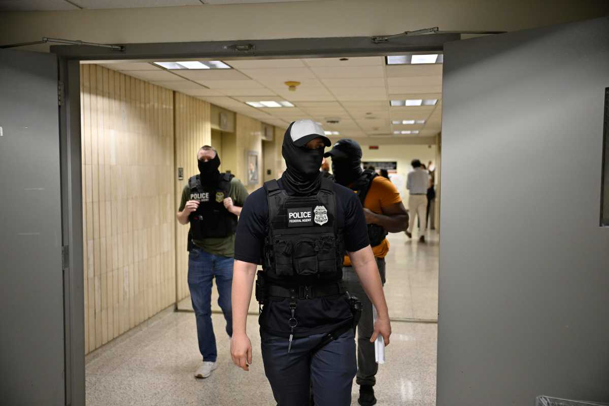 Masked federal agents roaming 26 Federal Plaza during immigration court hearings on June 21, 2025. 