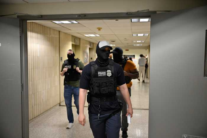 Mayor Adams defends masked ICE agents, calls it a matter of officer safety, in interview with amNY 2 Masked federal agents roaming 26 Federal Plaza during immigration court hearings on June 21, 2025.