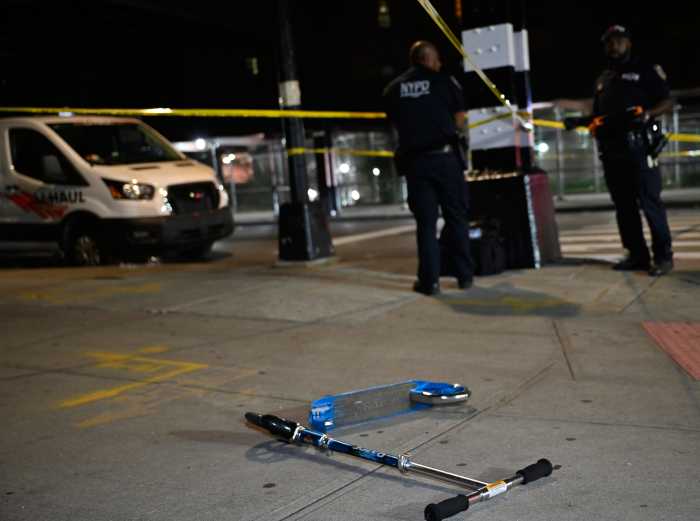 Scooter on ground at scene in Brooklyn where boy was shot