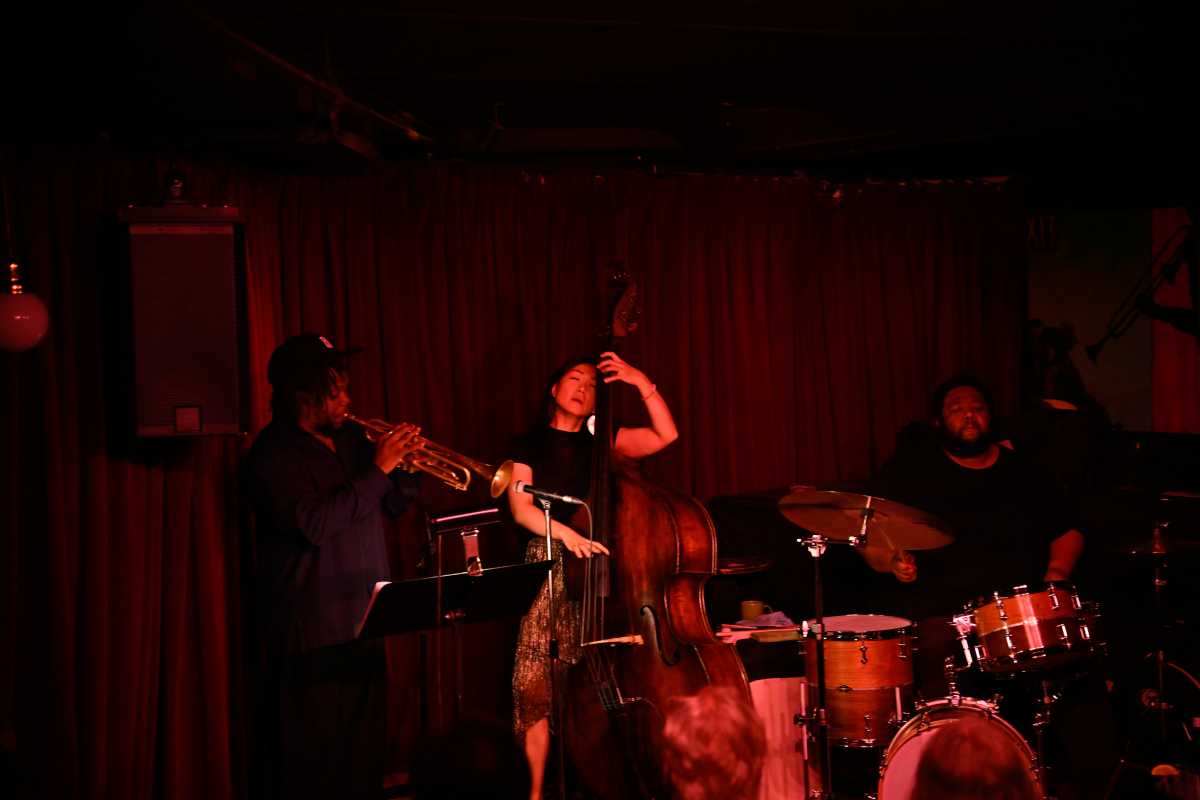 Jazz trumpet player Ambrose Akinmusire plays with Bassist LINDA MAY HAN OH  and Drummer  Tyshawn Sorey at Village Vanguard on Wednesday, June 25.