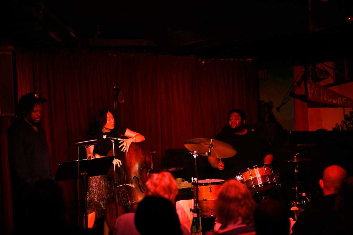 Jazz trumpet player Ambrose Akinmusire plays with Bassist LINDA MAY HAN OH  and Drummer  Tyshawn Sorey at Village Vanguard on Wednesday, June 25.