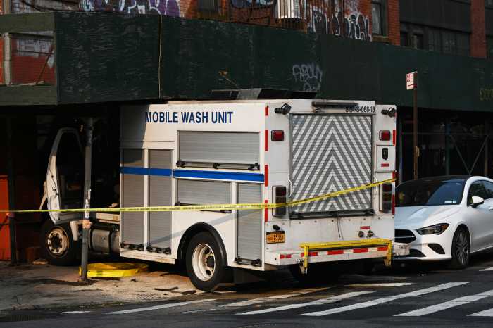 white truck and building scaffolding 