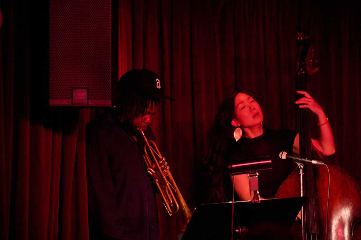Jazz trumpet player Ambrose Akinmusire plays with Bassist LINDA MAY HAN OH  and Drummer  Tyshawn Sorey at Village Vanguard on Wednesday, June 25.