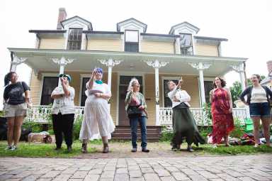 The Folk Music Society of New York performs at the 2024 "Porch Stomp" folk music festival on Governors Island.