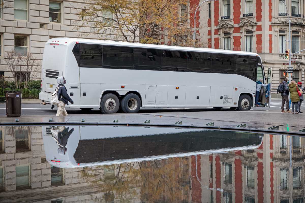 Bus reflected in fountain