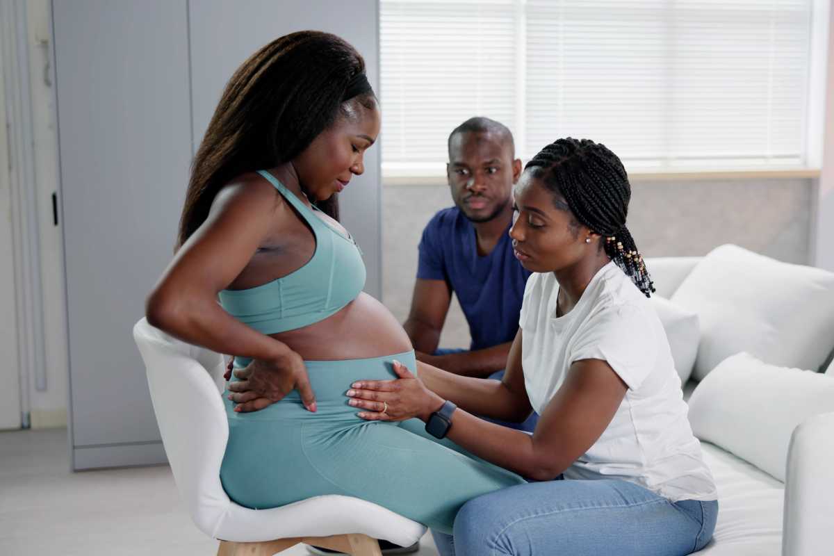 Doula working with pregnant woman