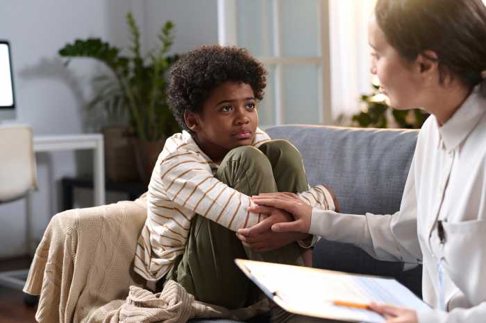Young person with therapist at mental health program